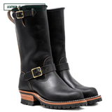 Pair of black leather boots with buckles on a white background