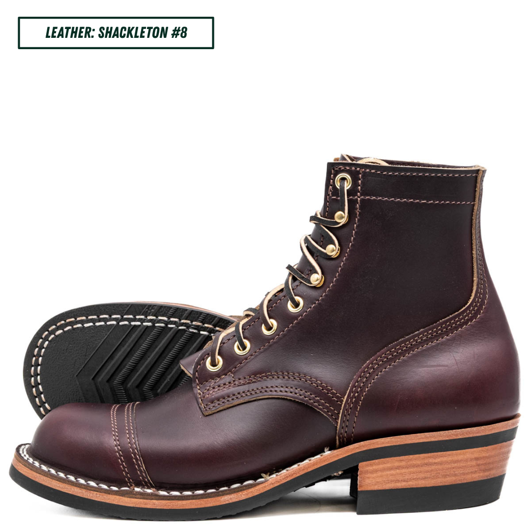A pair of dark burgundy leather lace-up ankle boots with gold-tone eyelets and white contrast stitching, shown on a white background with a text label reading 'LEATHER: SHACKLETON #8'.