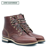 A pair of dark brown leather lace-up ankle boots with brass eyelets and black laces, shown on a white background with a text label in the top left corner.