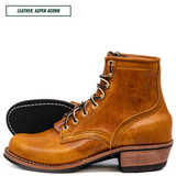 A single lace-up ankle boot in distressed tan leather, shown on a white background with the outsole visible behind it. Text at the top reads 'LEATHER: ASPEN ACORN'.
