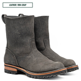 A pair of dark gray leather ankle boots with rugged lug soles and a tan midsole, shown on a white background with a text label reading 'LEATHER: 1964 GRAY'.
