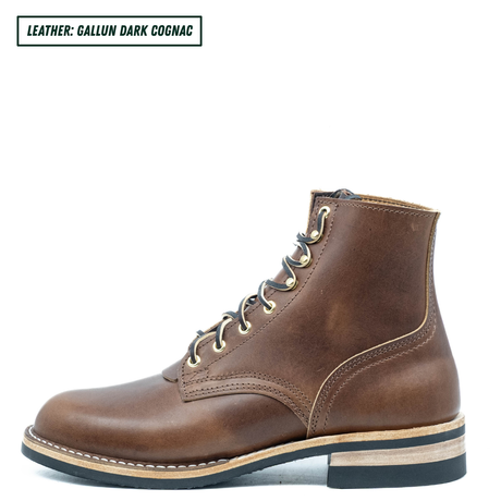 A single brown leather lace-up ankle boot shown in side profile on a white background, with a text label in the top-left corner reading 'LEATHER: GALLUN DARK COGNAC'.