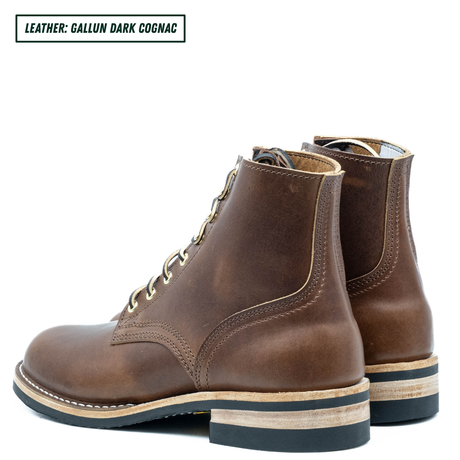 A pair of dark cognac brown leather lace-up ankle boots shown from a side profile view on a white background, with a text label in the top-left corner reading 'LEATHER: GALLUN DARK COGNAC'.