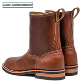 A pair of brown leather boots shown from the side and back on a white background, with a text label in the top-left corner reading 'LEATHER: 64 BROWN DOUBLE SHOT'.