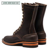 A pair of dark brown waxed leather lace-up boots shown from a side profile view on a white background, with a text label in the top-left corner reading 'LEATHER: BROWN WAXED FLESH'.