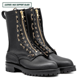 A pair of black leather lace-up combat boots with prominent gold-tone side zippers and matching gold eyelets, shown on a white background with a text label in the top left corner.