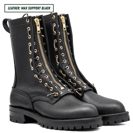 A pair of black leather lace-up combat boots with prominent gold-tone side zippers and matching gold eyelets, shown on a white background with a text label in the top left corner.