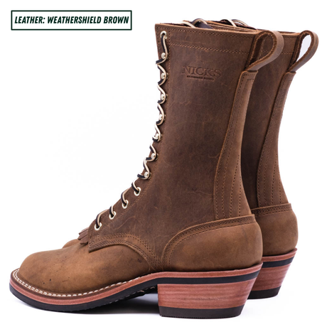 A pair of Nick's mid-calf lace-up boots in a weathered brown leather, shown from a side profile view against a white background. A text label in the top-left corner reads 'LEATHER: WEATHERSHIELD BROWN'.
