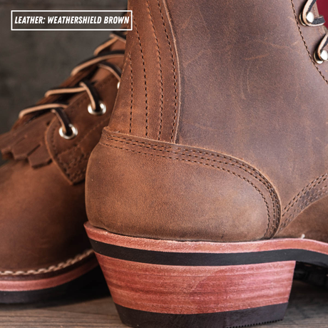 Close-up of a brown leather lace-up boot showing the heel, laces, and stacked wooden-look heel block. Text overlay reads 'LEATHER: WEATHERSHIELD BROWN'.