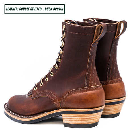 A brown double-stuffed leather lace-up boot with a stacked wood-look heel, shown in profile on a white background. A text label in the top-left corner reads 'LEATHER: DOUBLE STUFFED - BUCK BROWN'.