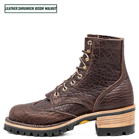 A dark brown textured leather lace-up boot with a chunky stacked block heel, black lug sole, and light tan midsole layer. The text 'LEATHER:SHRUNKEN BISON WALNUT' is displayed in the top-left corner.
