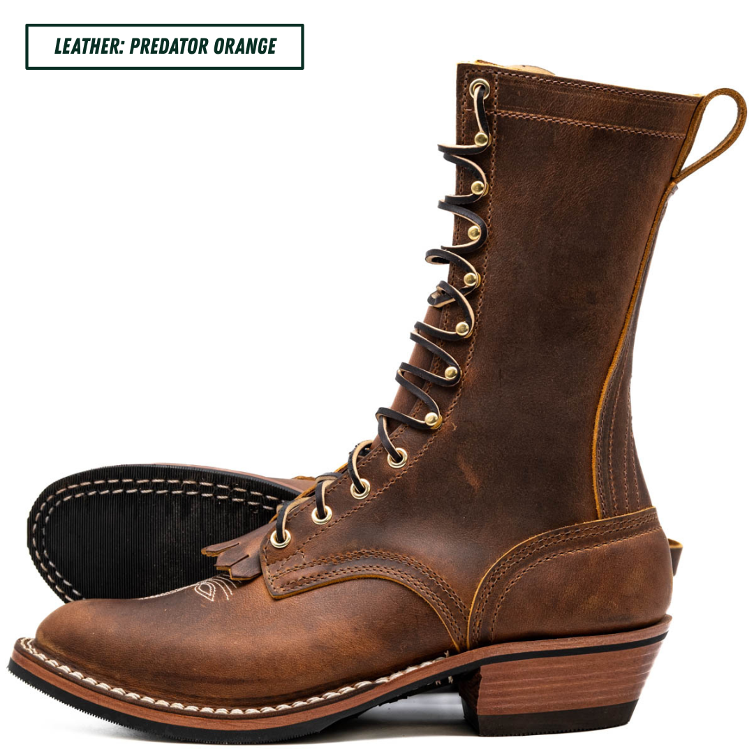 A brown leather lace-up boot shown in side profile on a white background, with a text label in the top-left corner that reads 'LEATHER: PREDATOR ORANGE'.