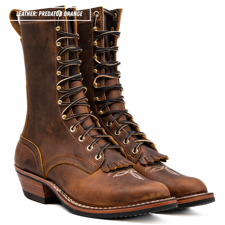 A pair of distressed brown leather lace-up boots with fringed detailing and gold-tone eyelets, shown on a white background with a text overlay in the top left reading 'LEATHER: PREDATOR ORANGE'.