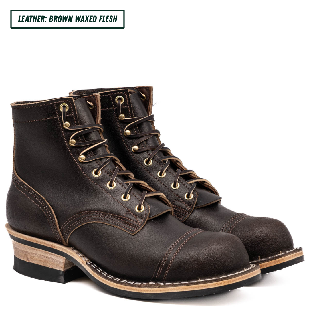 A pair of dark brown leather lace-up boots with brass eyelets and laces, shown on a white background with a text label in the top left corner that reads 'LEATHER: BROWN WAXED FLESH'.