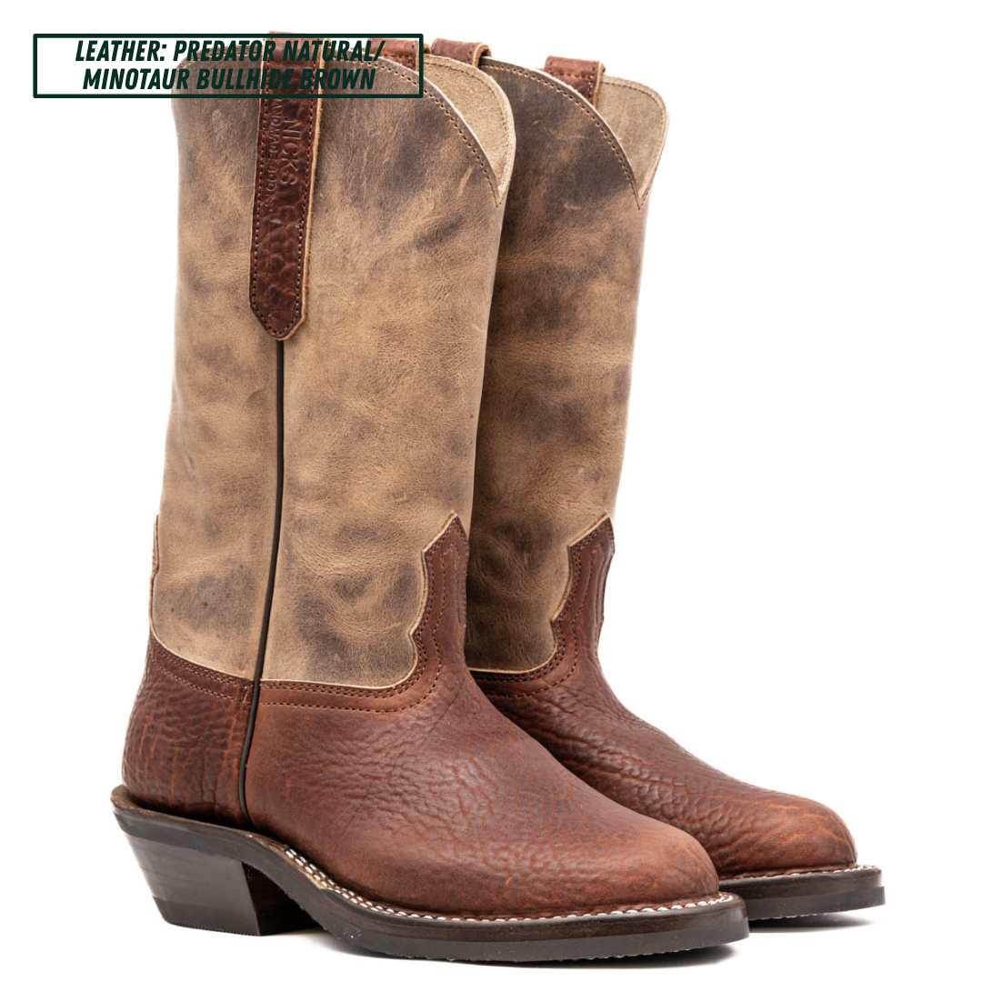 A pair of tall western boots in brown leather, featuring a distressed tan shaft and a darker brown textured toe and heel. A text overlay in the top left corner reads 'LEATHER: PREDATOR NATURAL / MINOTAUR BULLHIDE BROWN'.