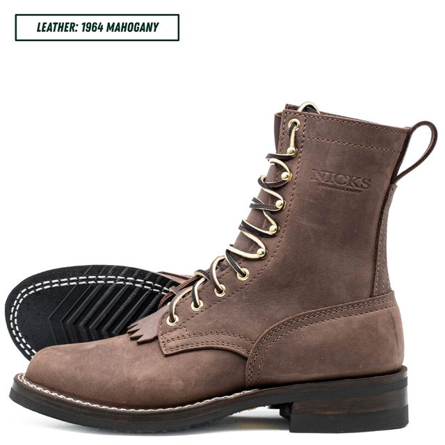 A brown suede lace-up ankle boot shown from the side with the sole turned up, on a white background. A text label in the top left reads 'LEATHER: 1964 MAHOGANY'.
