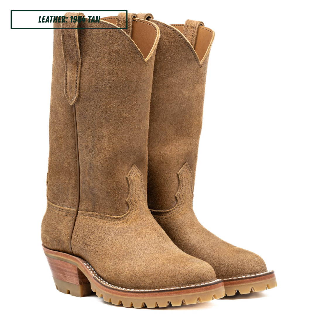 A pair of tan suede western-style boots shown in side profile on a white background. A small label in the top left reads 'LEATHER: 1964 TAN'.