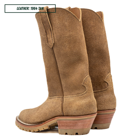 A pair of tan suede western-style boots shown in back profile on a white background. A small label in the top left reads 'LEATHER: 1964 TAN'.
