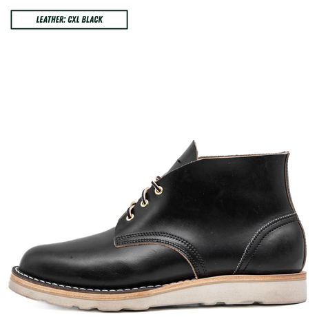 A black leather ankle boot with a light beige sole, shown in a side profile on a white background. A text box in the top left corner reads 'LEATHER: CXL BLACK'.