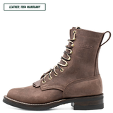 A brown suede lace-up ankle boot with gold-tone eyelets, a pull loop, and a low stacked heel, shown on a white background. A text label in the top-left corner reads 'LEATHER: 1964 MAHOGANY'.