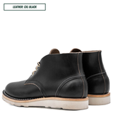 A black leather ankle boot with a light beige sole, shown in a side profile on a white background. A text box in the top left corner reads 'LEATHER: CXL BLACK'.