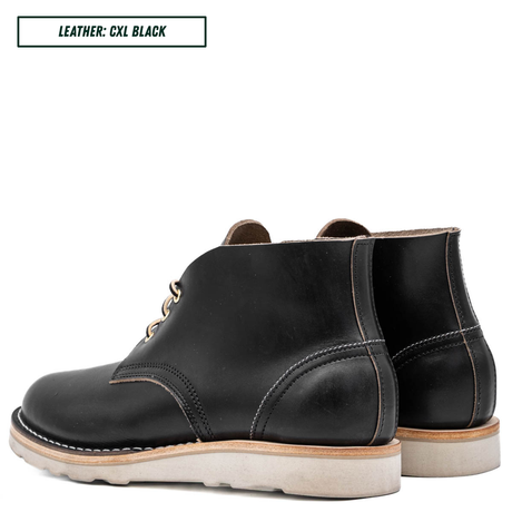 A black leather ankle boot with a light beige sole, shown in a side profile on a white background. A text box in the top left corner reads 'LEATHER: CXL BLACK'.