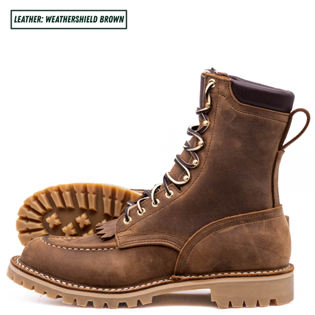 A pair of brown leather lace-up boots shown on a white background, with one boot standing upright and the other lying on its side to display the sole. A text label in the top left corner reads 'LEATHER: WEATHERSHIELD BROWN'.