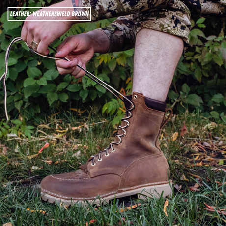 Model laces up brown leather boot with padded collar and moc toe. Top left reads 'LEATHER: WEATHERSHIELD BROWN'.
