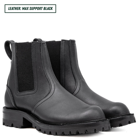 Blackout Chelsea boots sitting together showing the front of the boots. Top left reads 'LEATHER: MAX SUPPORT BLACK'.