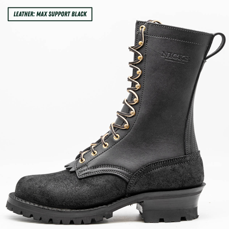 A black leather lace-up work boot shown in profile against a white background, with a text label in the top-left corner reading 'LEATHER: MAX SUPPORT BLACK'. The boot features gold-tone eyelets and laces, and the brand name 'NICKS' is embossed on the side.