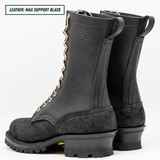 A pair of black leather work boots with gold metal eyelets and laces, shown from a three-quarters angle on a white background. A text overlay in the top left corner reads 'LEATHER: MAX SUPPORT BLACK'.