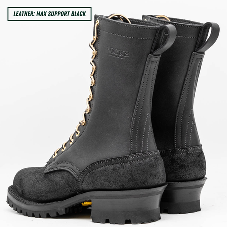 A pair of black leather work boots with gold metal eyelets and laces, shown from a three-quarters angle on a white background. A text overlay in the top left corner reads 'LEATHER: MAX SUPPORT BLACK'.