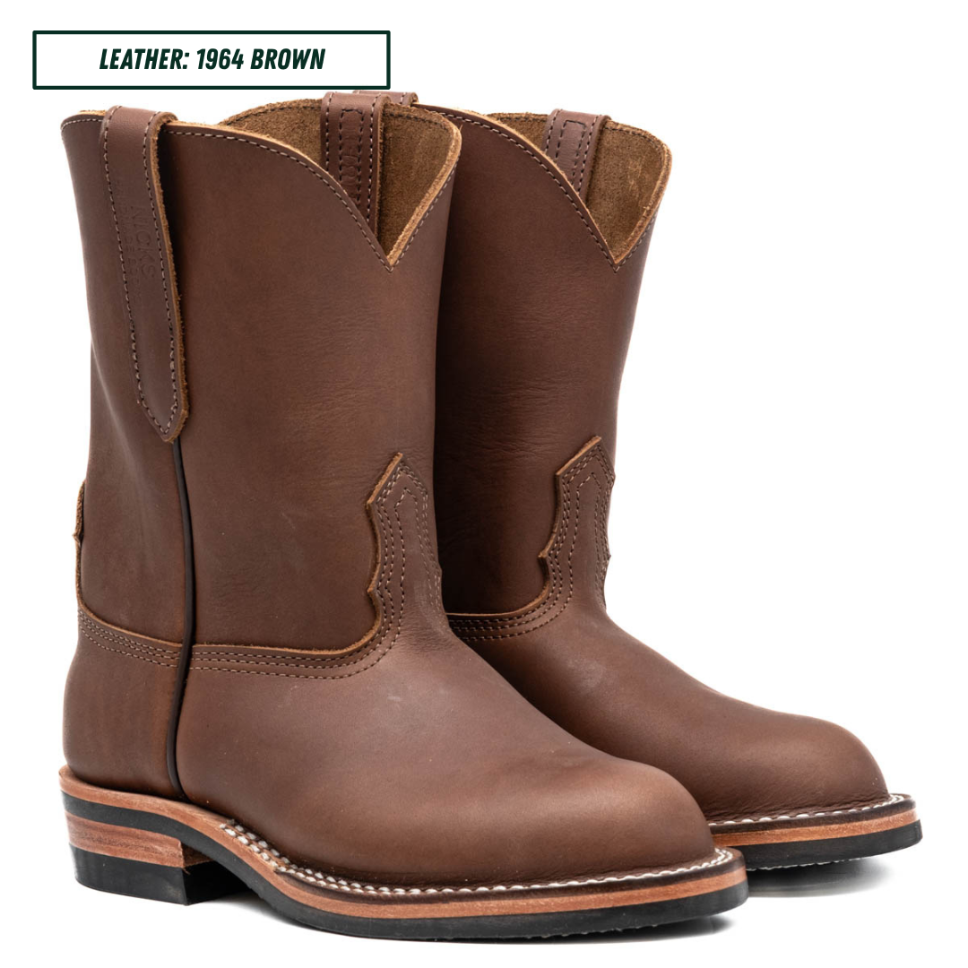 A pair of brown leather cowboy boots shown on a white background with a text label in the top left that reads 'LEATHER: 1964 BROWN'.