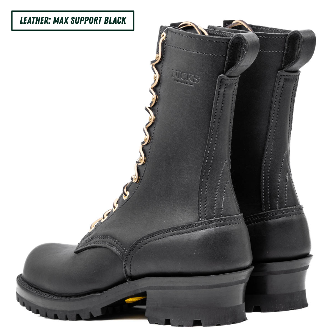 A pair of black leather lace-up boots shown from the side and back on a white background, with a text label in the top-left corner that reads 'LEATHER: MAX SUPPORT BLACK'. The boots feature a thick lug sole, a pull tab at the heel, and leather laces.