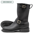 A pair of black leather mid-calf boots with gold-tone buckle straps, shown on a white background with one boot standing upright and the other lying flat to display the sole.