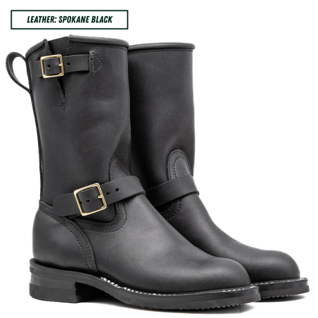 A pair of black leather mid-calf boots with gold-tone buckle straps, shown on a white background with a text label at the top reading 'LEATHER: SPOKANE BLACK'.