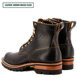 A pair of brown waxed leather lace-up work boots shown from a three-quarter angle on a white background, with a text label in the top-left corner reading 'LEATHER: BROWN WAXED FLESH'.