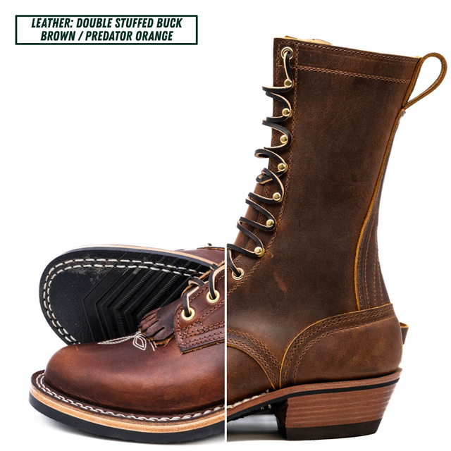 A pair of double-stuffed buck brown leather lace-up boots shown on a white background, with one boot standing upright and the other lying on its side to display the sole. A text label in the top left reads 'LEATHER: DOUBLE STUFFED BUCK BROWN / PREDATOR ORANGE'.
