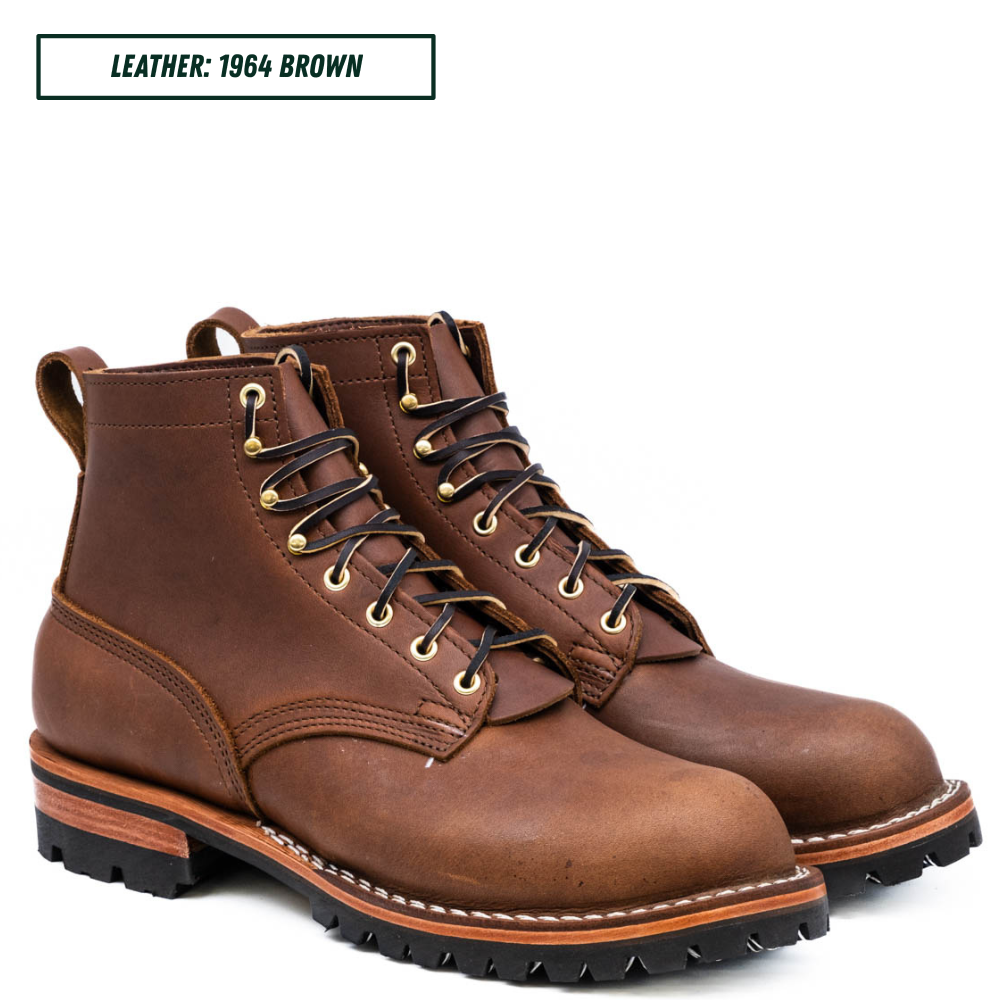 A pair of brown leather lace-up work boots shown on a white background, with a text label in the top left that reads 'LEATHER: 1964 BROWN'.