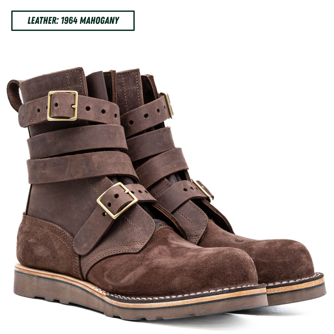 A dark brown leather ankle boot with multiple strap buckles, shown in profile against a white background. A text label in the top left reads 'LEATHER: 1964 MAHOGANY'.