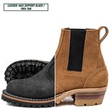 A split-view product image of a Chelsea-style ankle boot showing two color options: a black suede upper with a black elastic side panel and sole, and a tan/cognac suede upper with a black elastic side panel and tan sole. A text label at the top reads 'LEATHER: MAX SUPPORT BLACK / 1984 TAN'.
