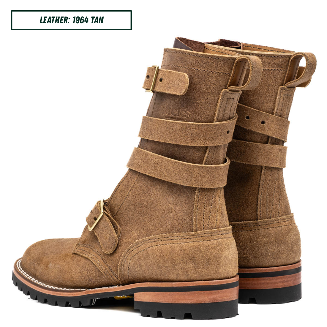 A pair of mid-calf leather boots in tan, featuring multiple decorative straps with brass buckles and pull tabs on the sides, set against a plain white background with a text label in the top left corner.