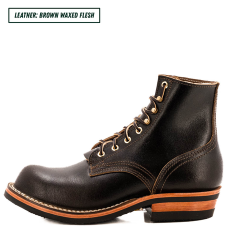 A single dark brown leather lace-up boot shown in side profile on a white background, with a text label in the top-left corner reading 'LEATHER: BROWN WAXED FLESH'. The boot has tan stitching, brass eyelets, and a stacked sole with a tan midlayer and black outsole.