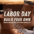 Promotional graphic with large white text reading 'LABOR DAY BUILD YOUR OWN' and smaller text 'PRODUCT AVAILABLE UNTIL 9/8 OR WHILE SUPPLIES LAST' over a blurred photo of brown lace-up work boots.