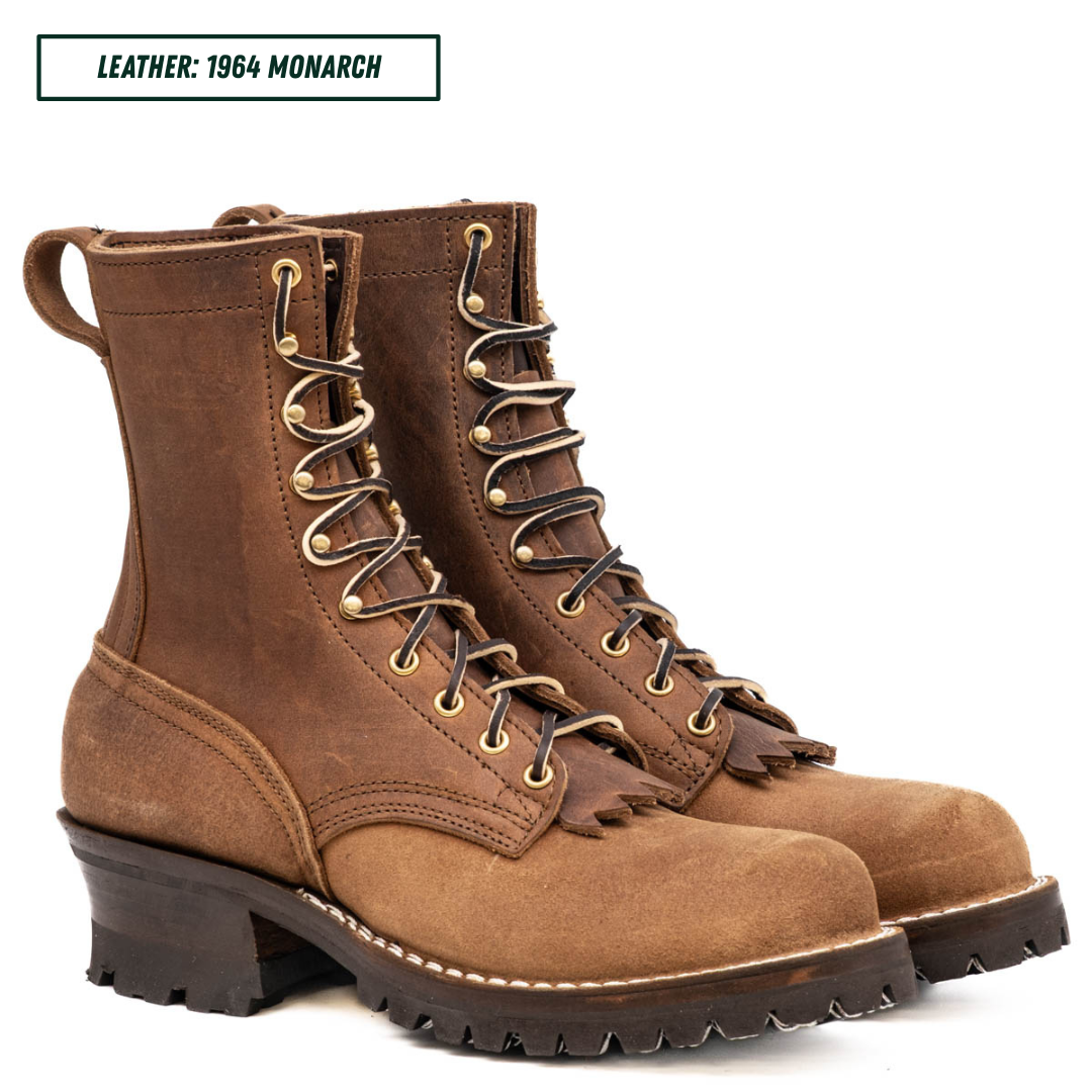 A pair of brown leather lace-up boots with gold-toned metal eyelets and dark laces, shown on a white background with a text label reading 'LEATHER: 1964 MONARCH' in the top-left corner.