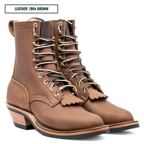 A pair of brown leather lace-up boots with metal eyelets and a stacked wood-look heel, shown on a white background with a text label reading 'LEATHER: 1964 BROWN'.