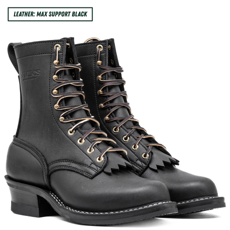 A pair of black leather lace-up boots with gold-tone eyelets and a fringe detail on the front, shown against a white background with a text label in the top left corner.