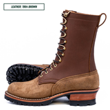 A brown leather lace-up work boot shown in side profile on a white background, with a second boot partially visible behind it. A small label in the top left reads 'LEATHER: 1964 BROWN'.