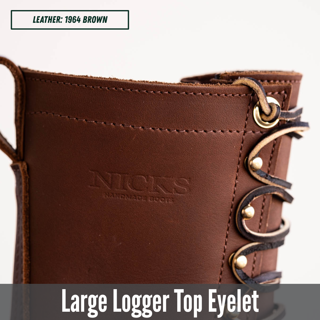 Close-up of a brown leather boot showing the upper side with a large metal eyelet, decorative laces, and the embossed brand name 'NICKS'. Text overlays indicate 'LEATHER: 1964 BROWN' and 'Large Logger Top Eyelet'.