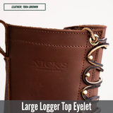 Close-up of a brown leather boot showing the upper side with a large metal eyelet, decorative laces, and the embossed brand name 'NICKS'. Text overlays indicate 'LEATHER: 1964 BROWN' and 'Large Logger Top Eyelet'.